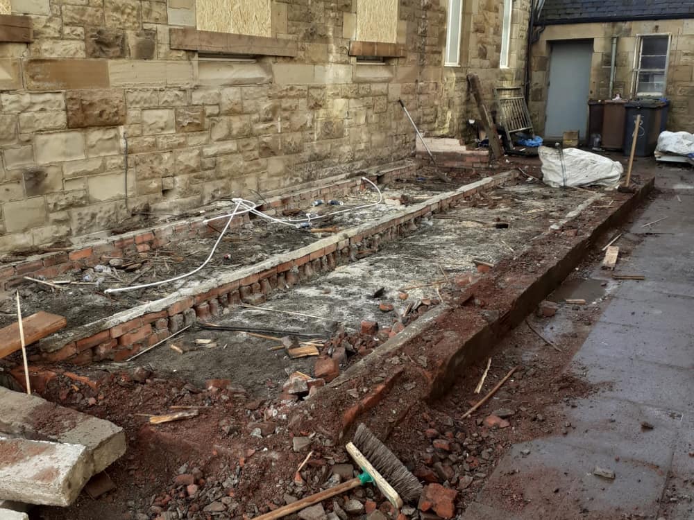 Old floor removed down to the brick sleeper walls