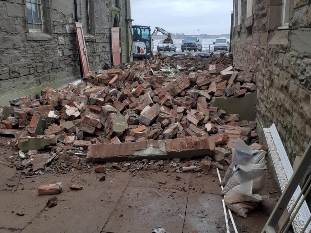 Cleared brickwork with the Ardrossan seafront behind