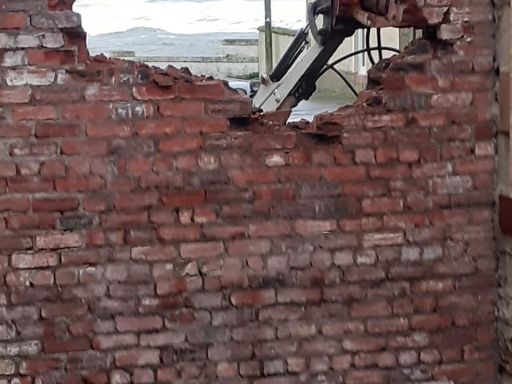 New opening formed through a brick wall looking out towards the bay