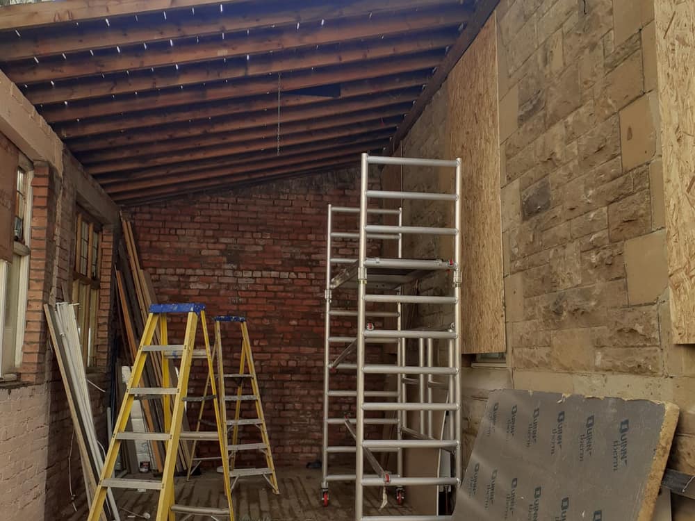Tower scaffold and insulation boards during internal renovation works