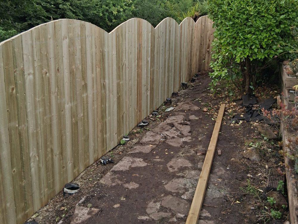 Completed 6ft close-board timber fence running the length of a garden boundary